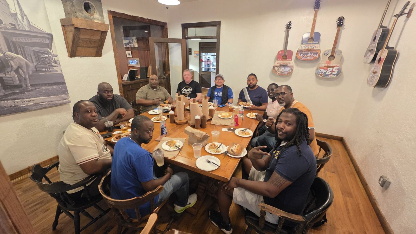 ADSC dads gathered around a table